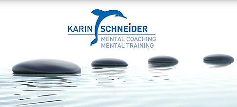 Logo von Karin Schneider Mental Coaching über ruhigem Wasser mit Steinen im Vordergrund
